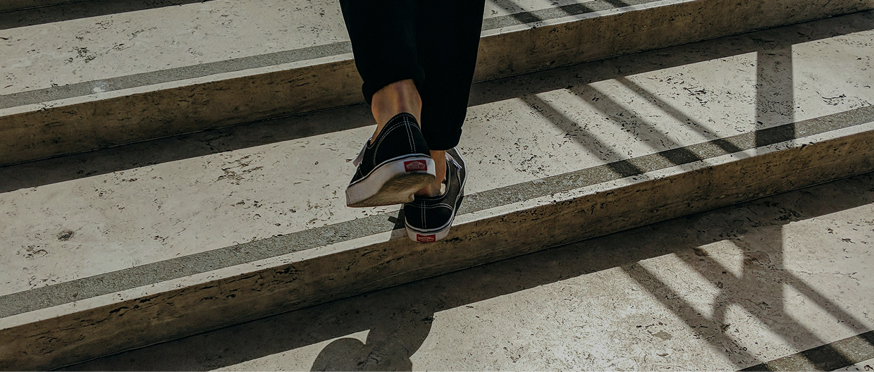 Person stepping up stairs